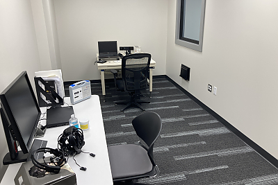 Narrow office space with computer and other equipment
