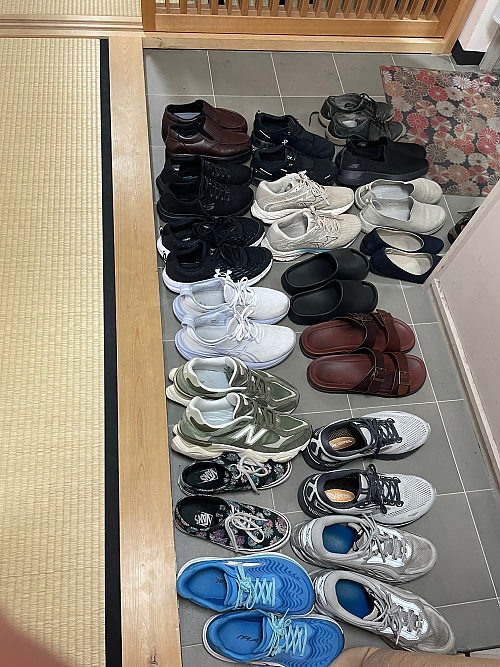 A group of shoes removed by students before entering tea room