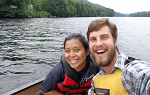 Josh Ascani and a student take a selfie from a canoe on the Connecticut River. 