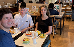 Three students sitting together at breakfast 