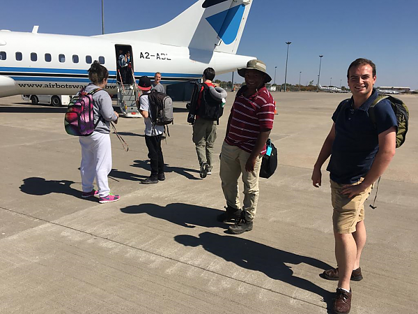 Students on 2019 Study Abroad trip deplane onto tarmac at Maun Botswana