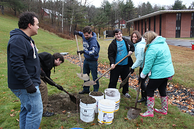 Students planting trees on Landmark College campus