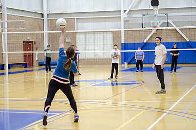 Landmark College students playing volleyball in Click Center