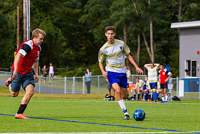 Landmark College soccer player moves the ball